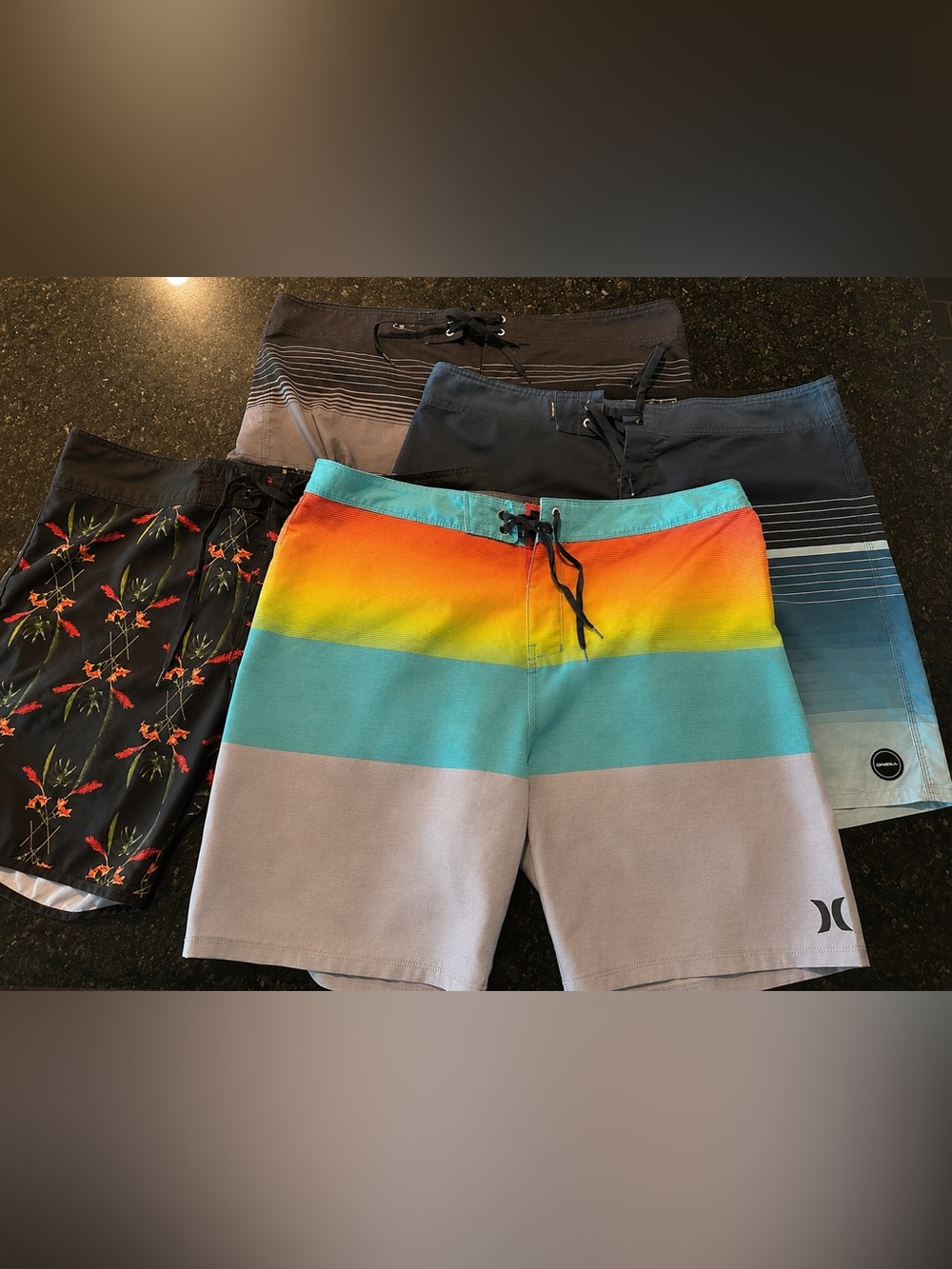 4 pairs of Men’s size 38 Board Shorts - O’niell, Hurley and Ezekiel.